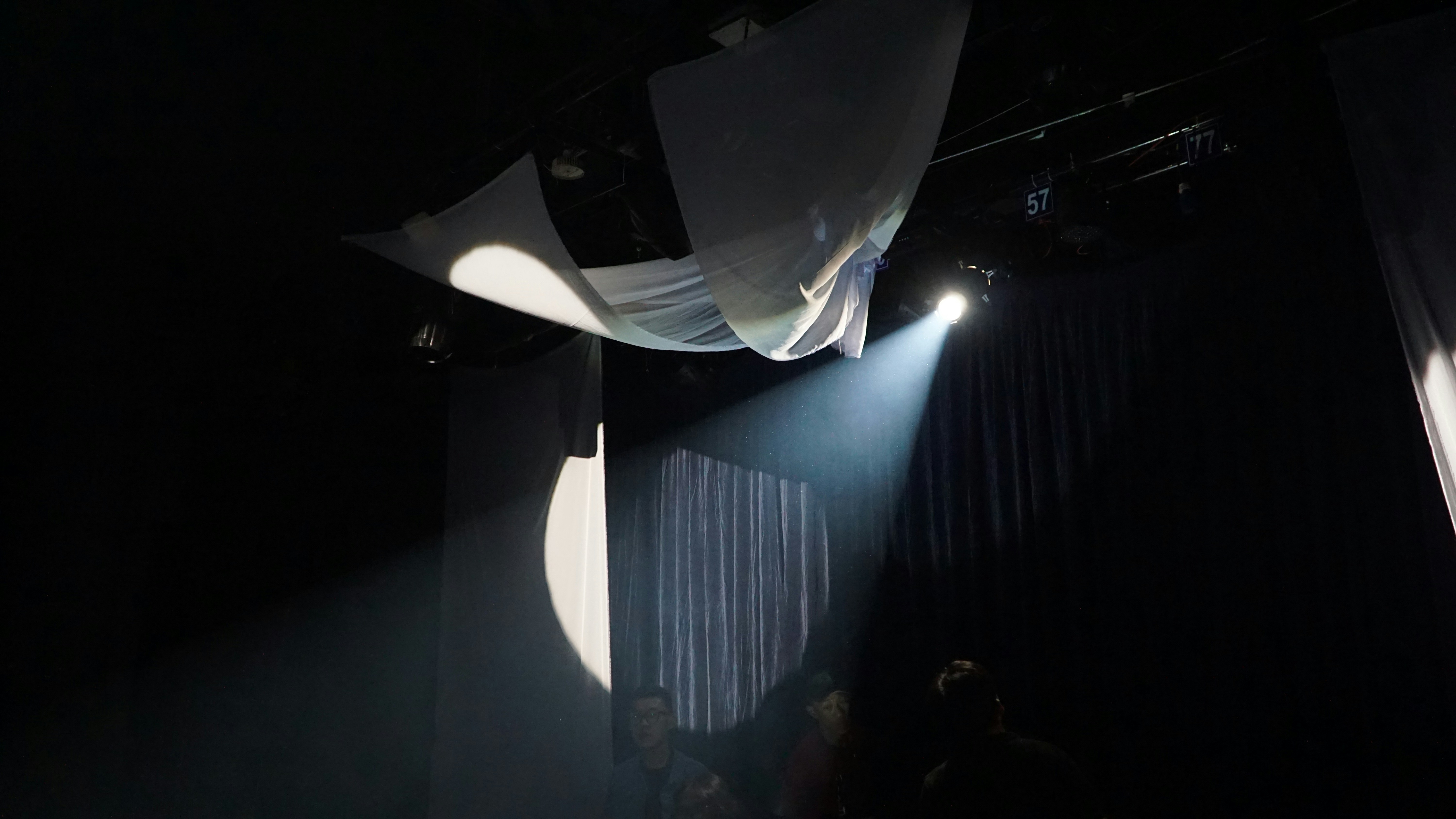 A spotlight shines on a stage.