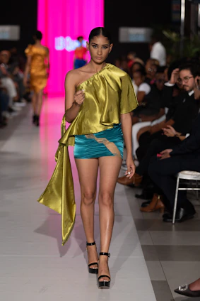A model walks the runway in a designer outfit.