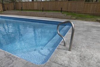 A beautiful swimming pool awaits for a swim.