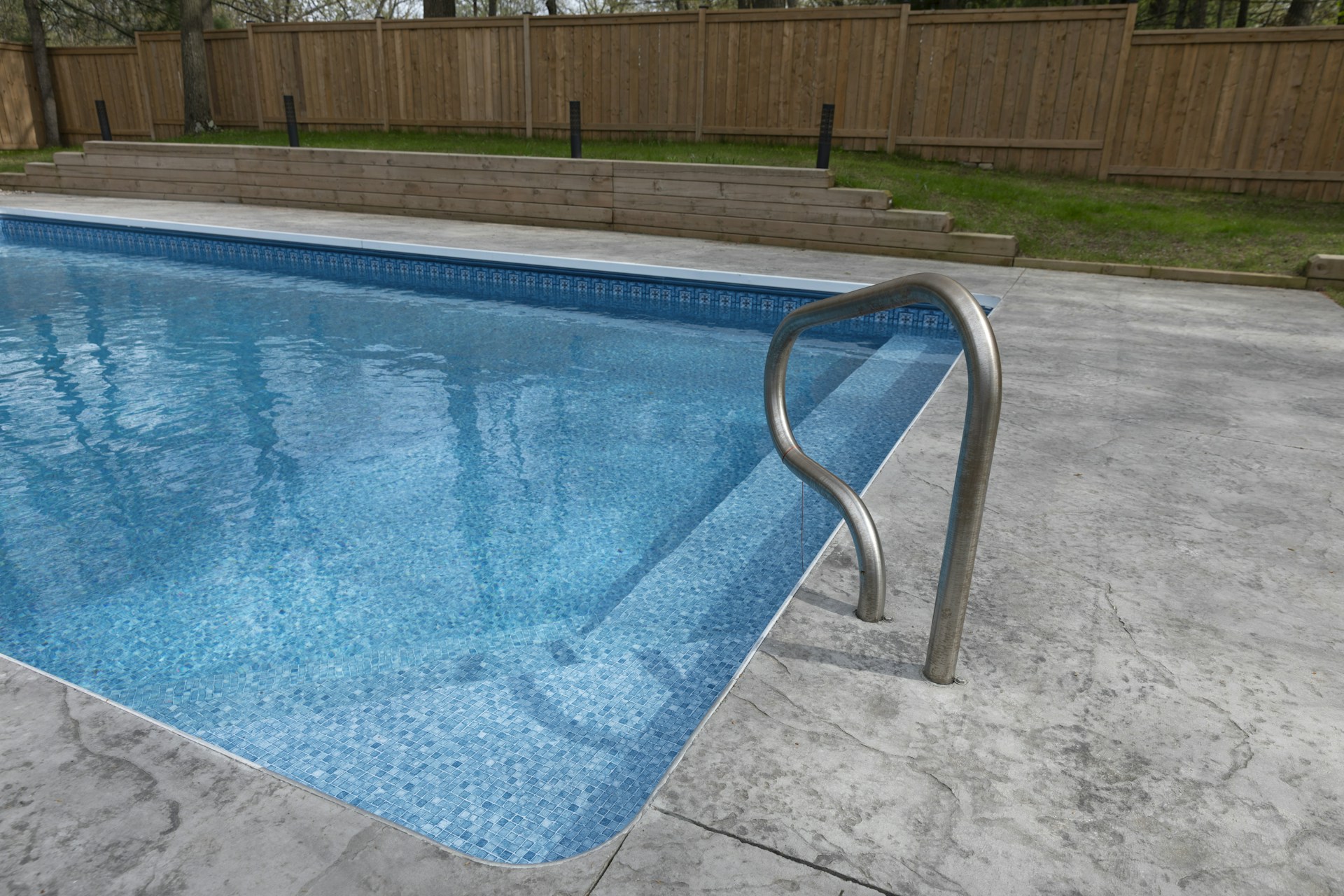 A beautiful swimming pool awaits for a swim.