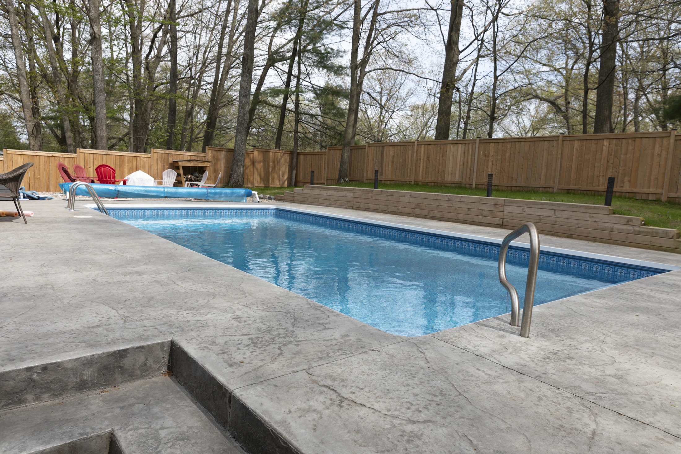 Rectangular swimming pool in a residential backyard