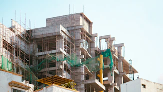 A building is under construction with scaffolding.