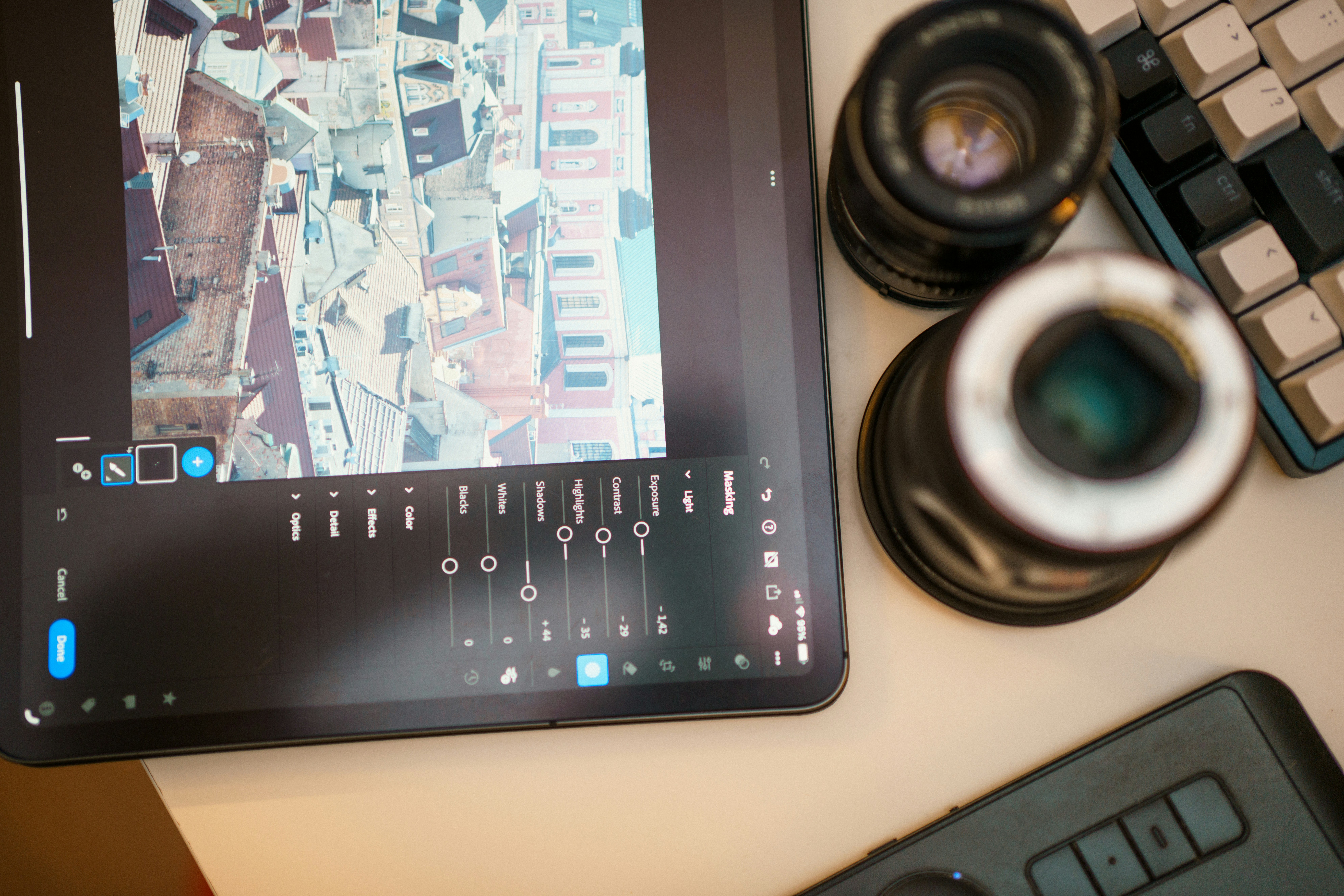 Image editing on a tablet with photography gear.
