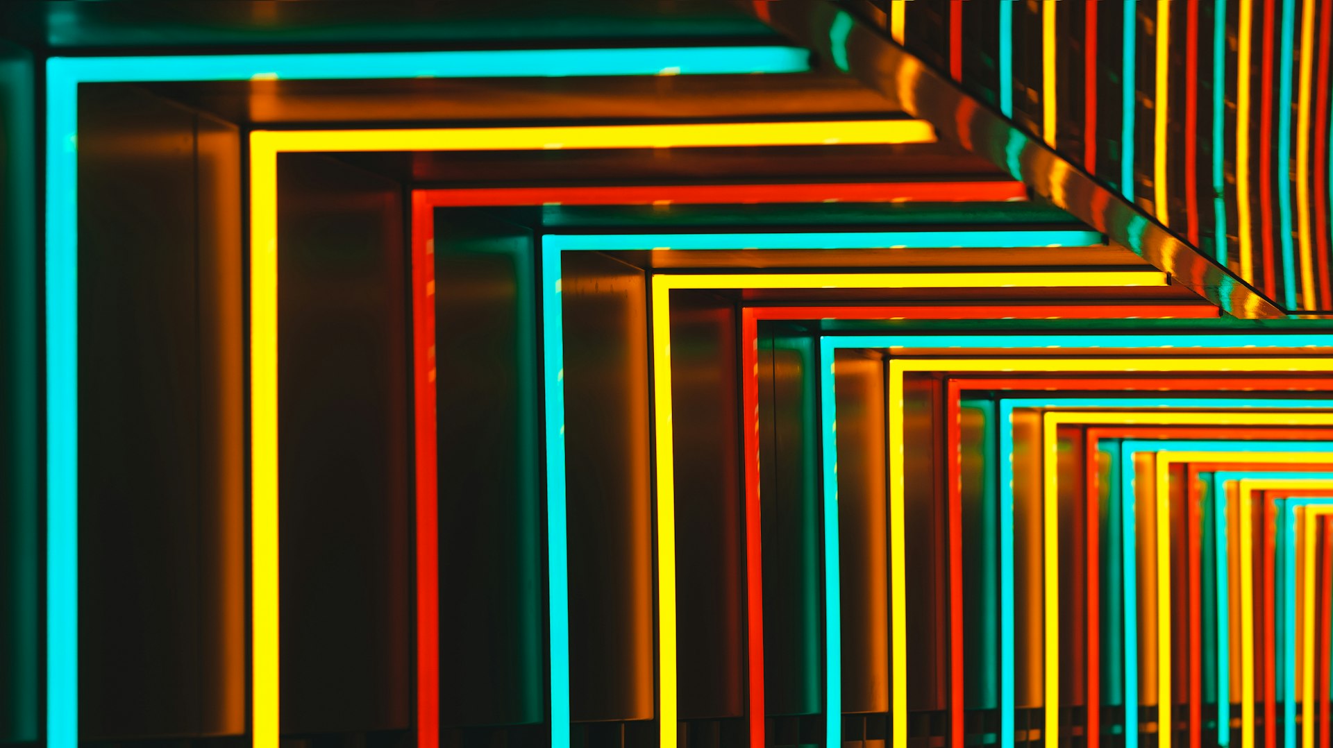 Colorful neon lights form geometric shapes.