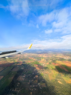 View from an airplane window, looking at the landscape.