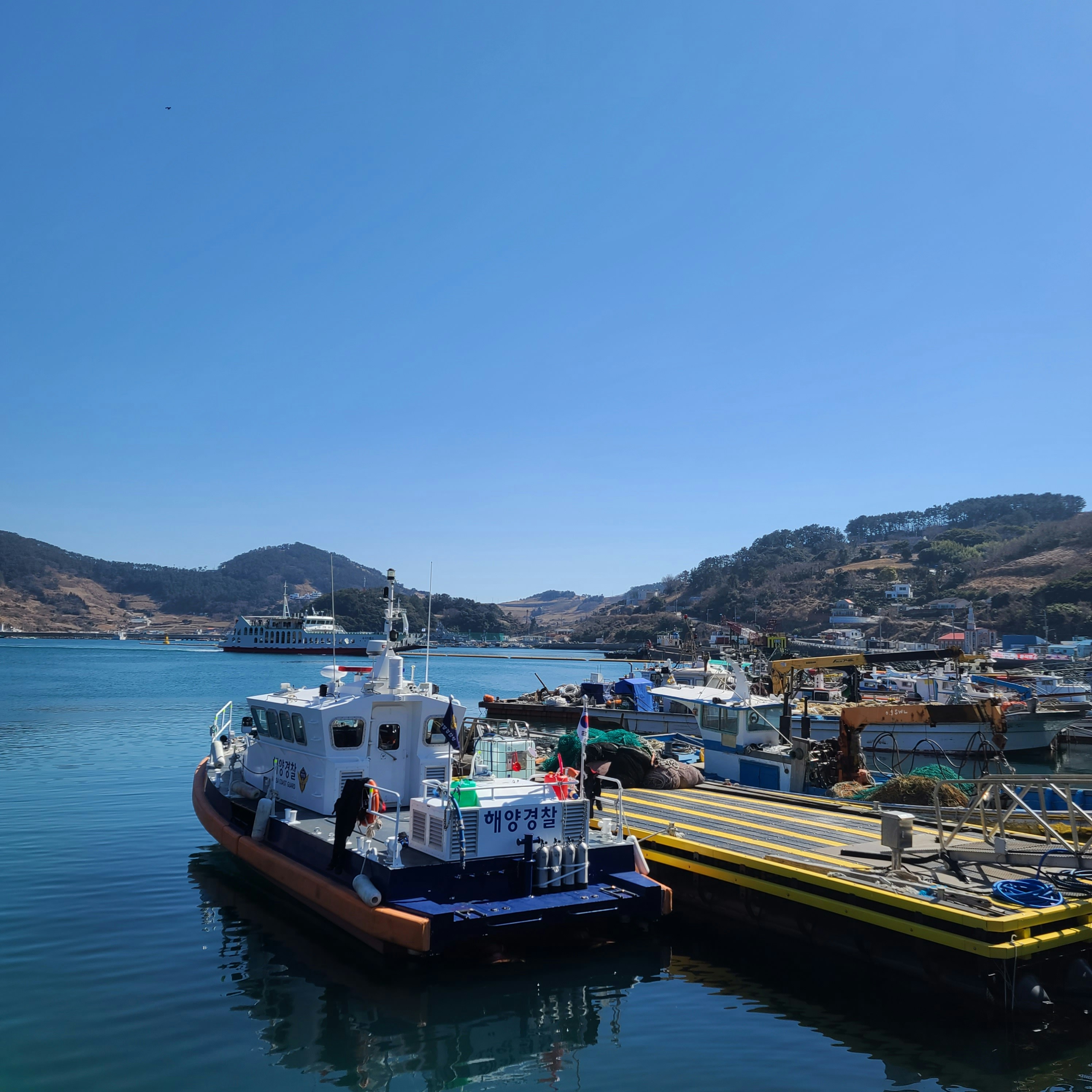 Boats and docks sit in a beautiful harbor.