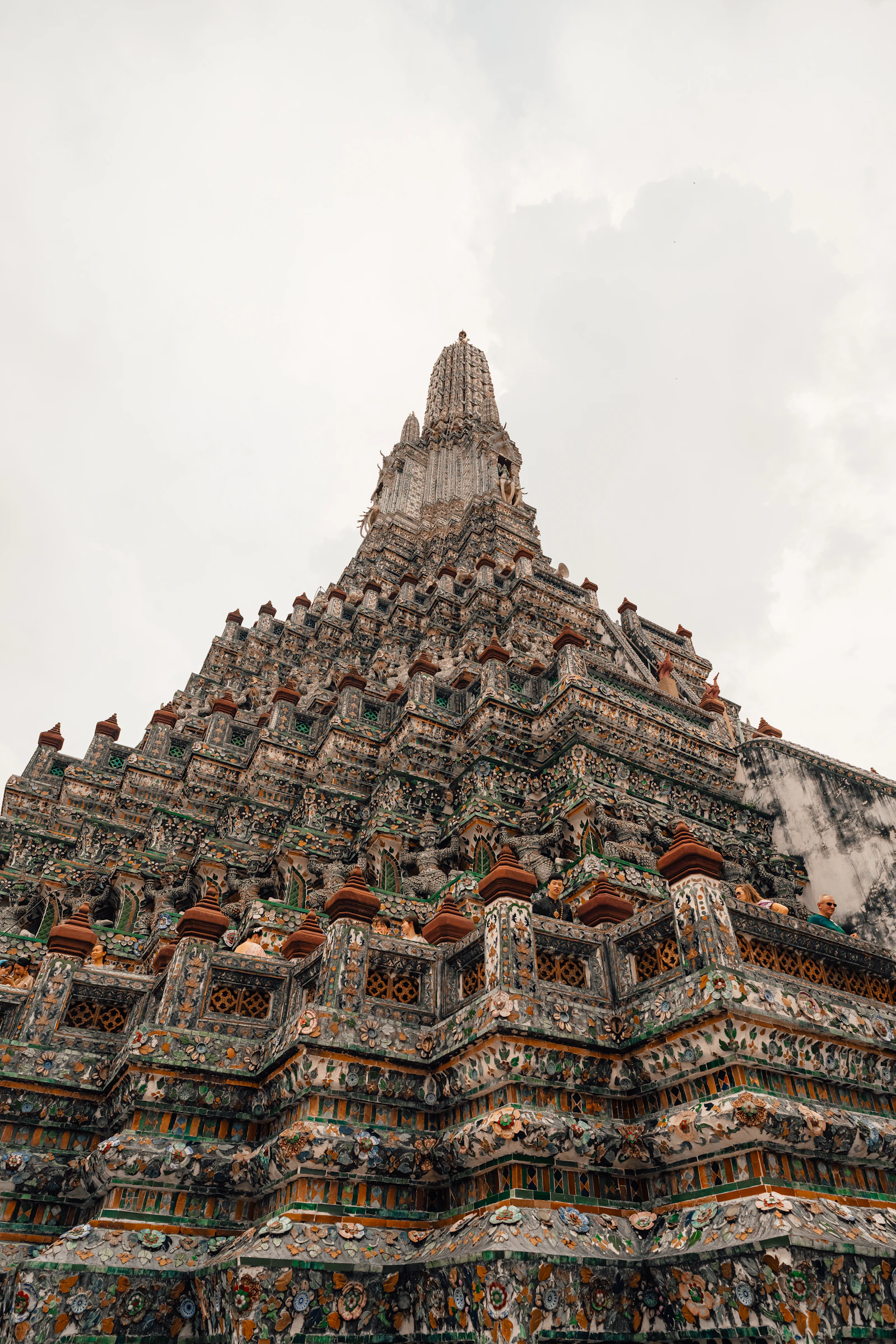 Wat Arun temple spire rising against the Bangkok sky
