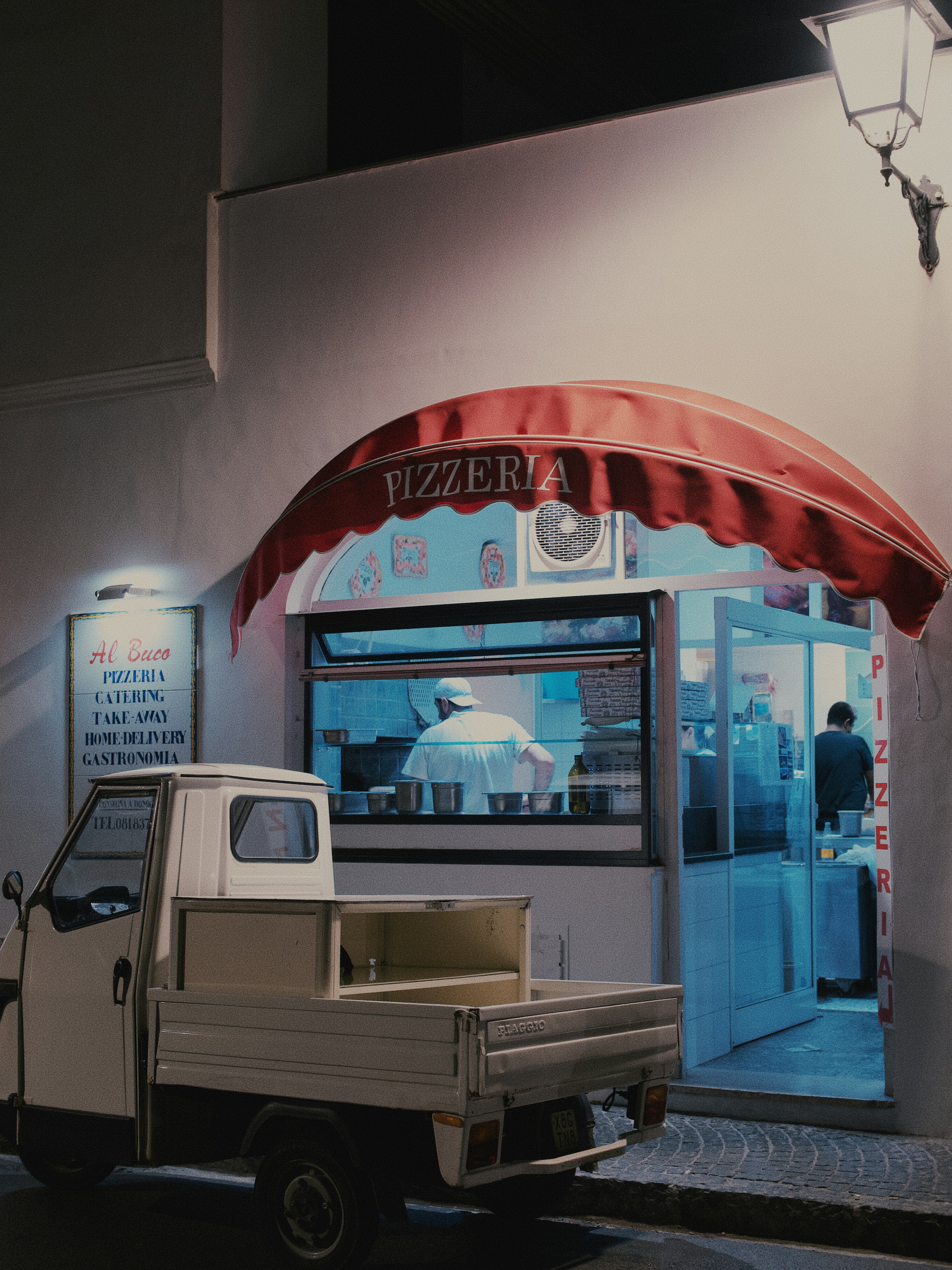 A modern salon with digital management tools displayed on screens