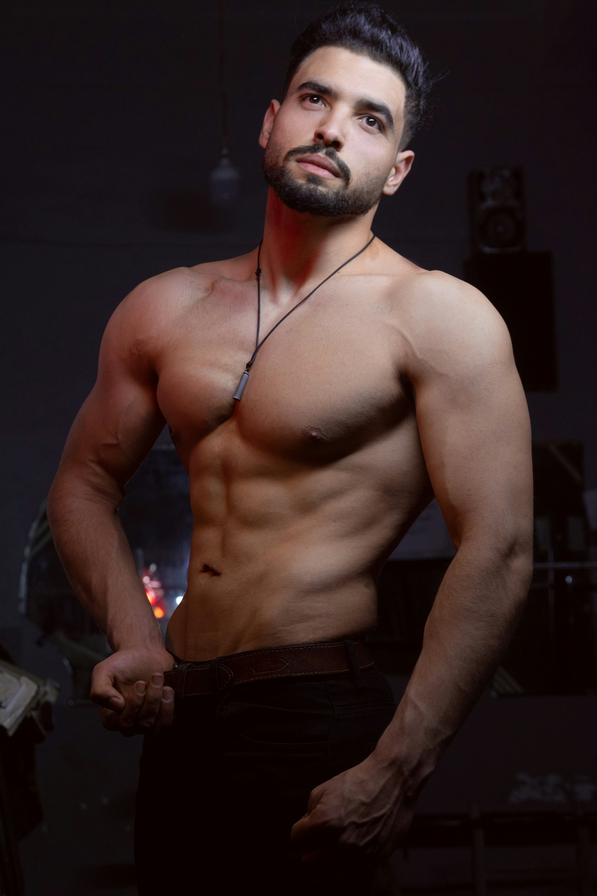 Muscular man flexes for the camera.