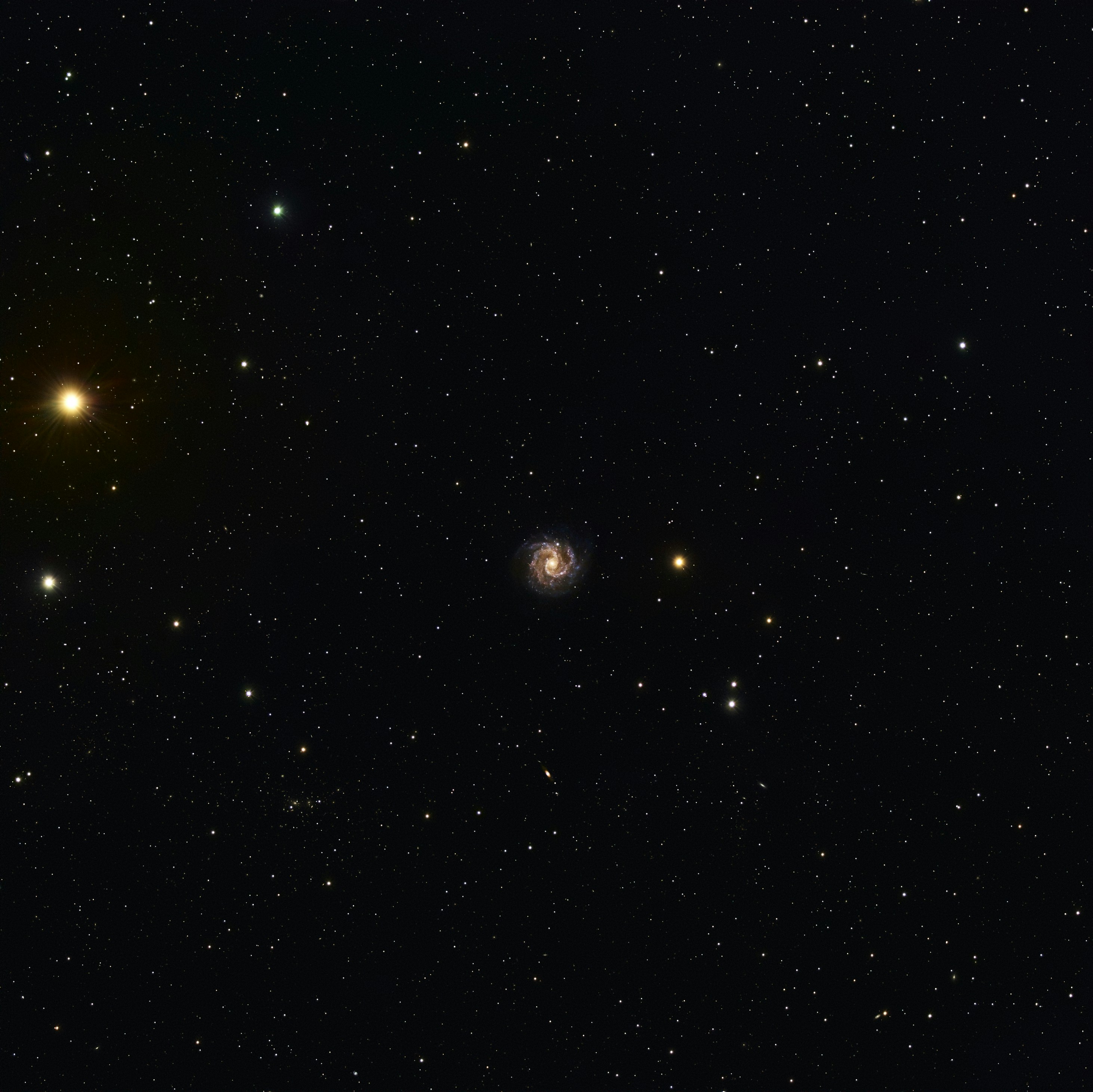 NGC3184 Galaxy at 40 million light-years distant, and red giant star Mu Ursa Majoris at 230 light-years distant (large orange star upper left).