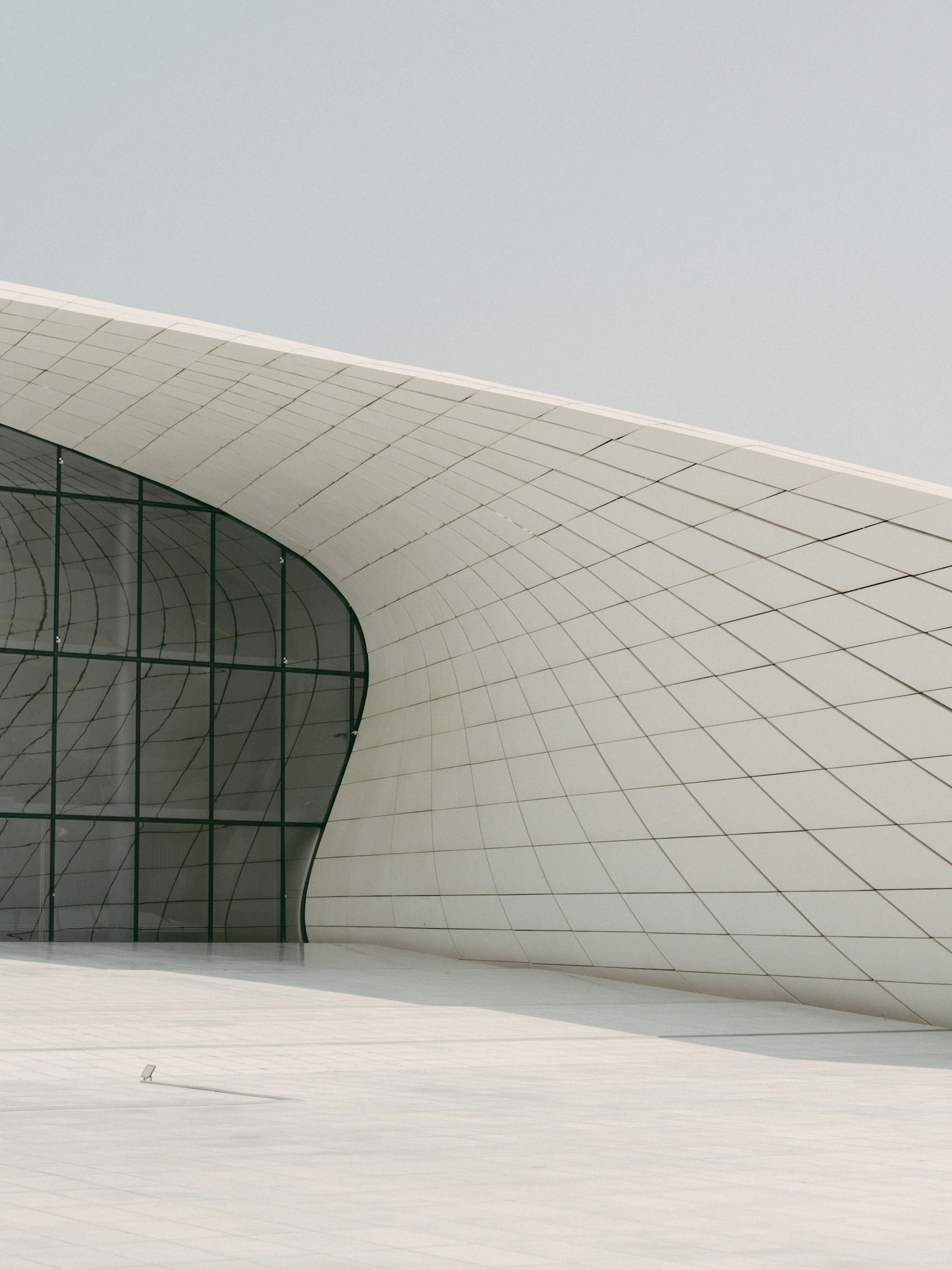 Flowing white architecture of Heydar Aliyev Centre in Baku, Azerbaijan