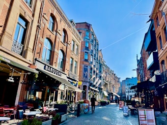 Beautiful buildings line a sunny european street.