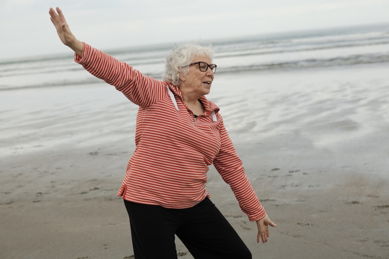 Senior practicing gentle balance work with a chair for fall prevention