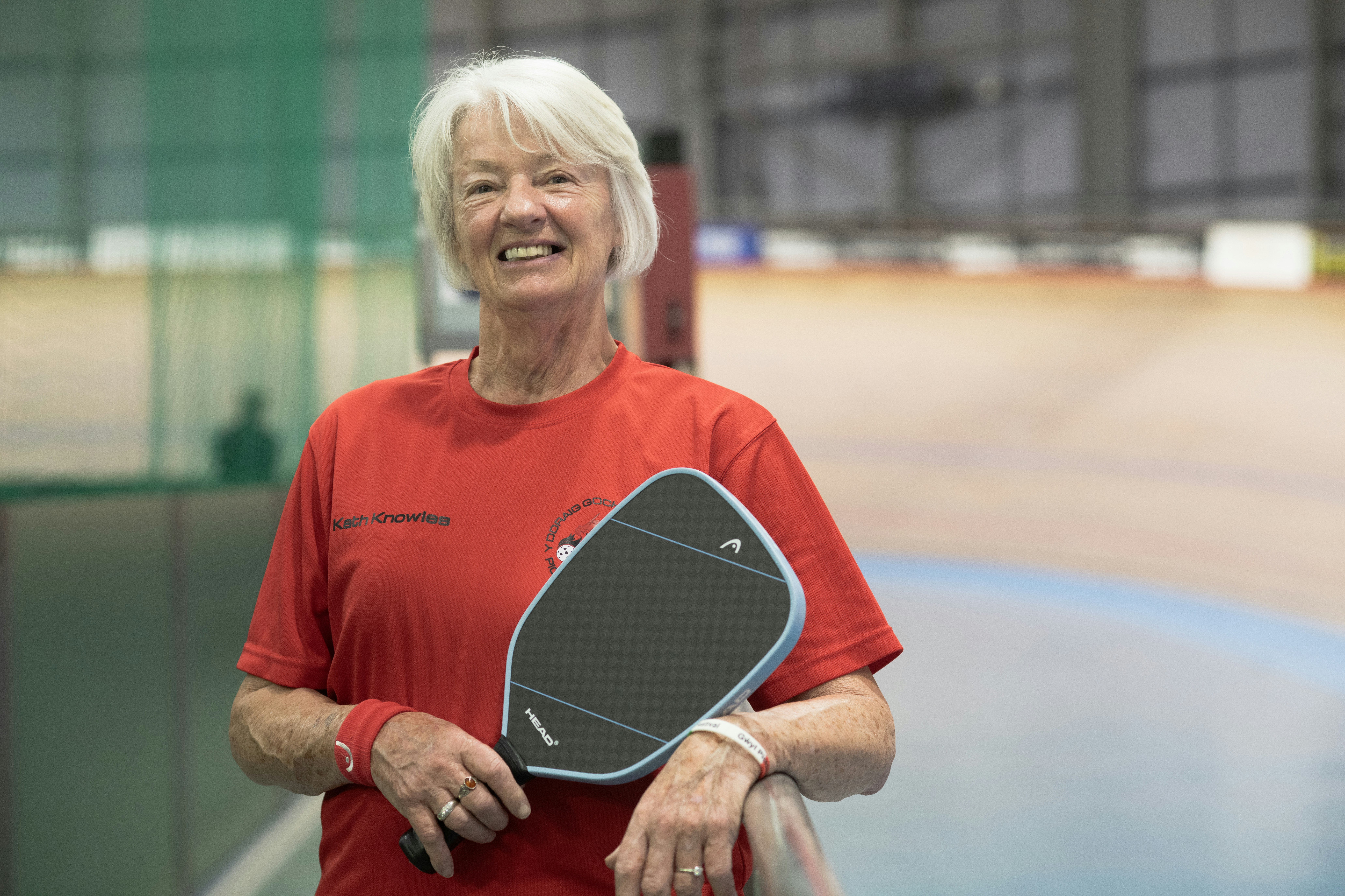 Coach with pickleball paddle