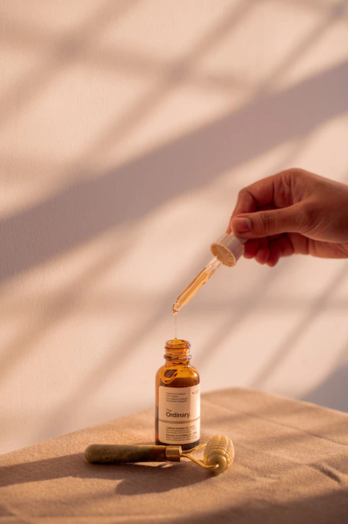 Serum dropper on skin