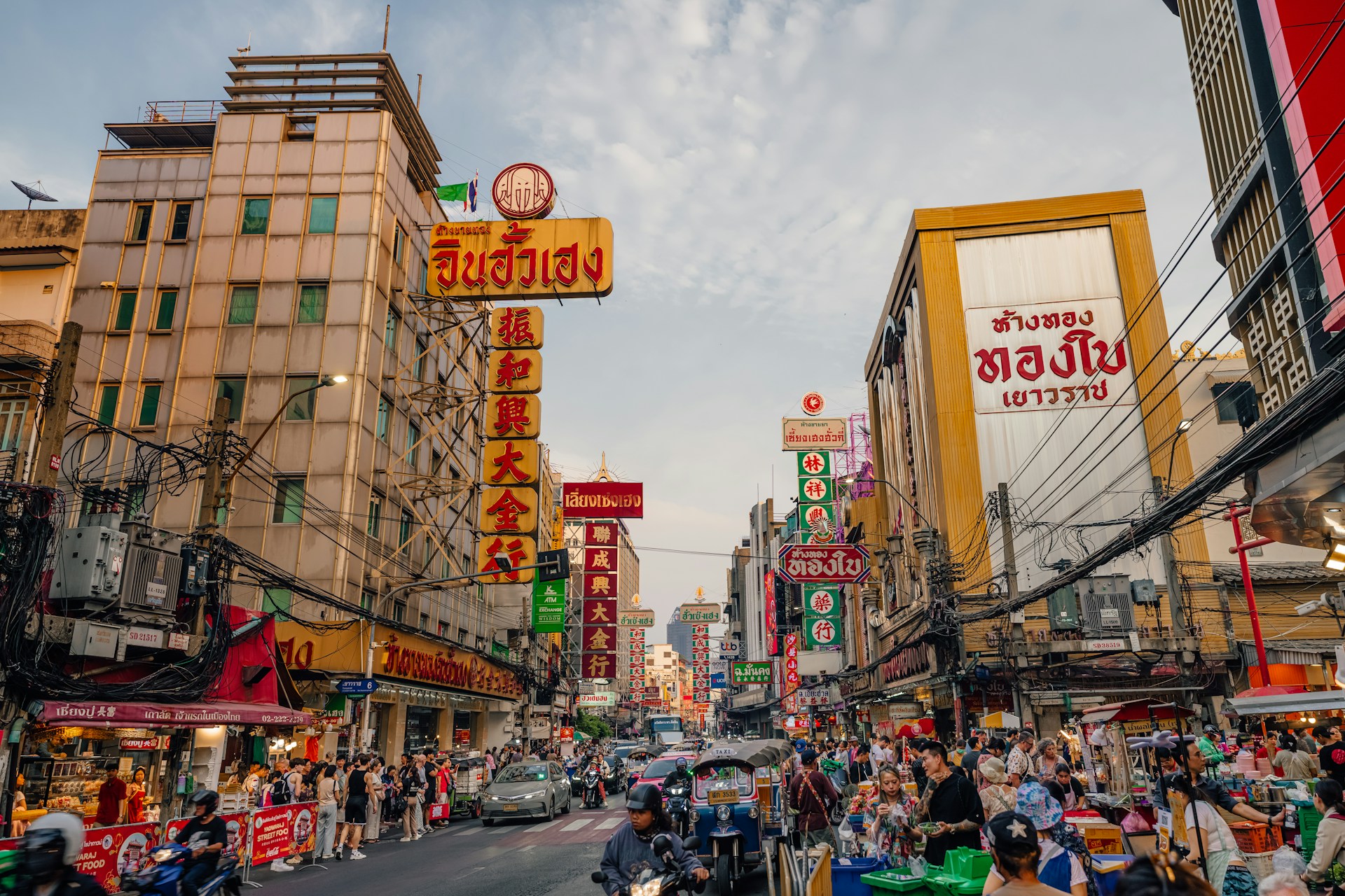A crowded street scene in an asian city.