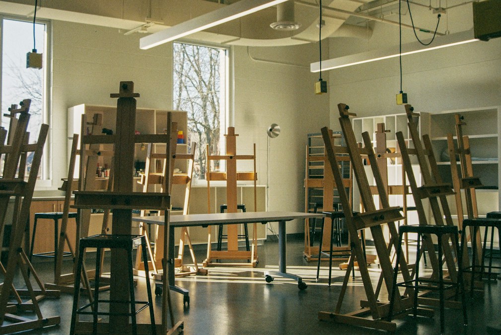 Art studio with easels and natural light, ready for a painting class