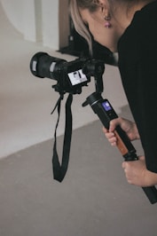 Woman films with a camera on a stabilizer.
