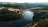A bridge crosses a dark body of water.