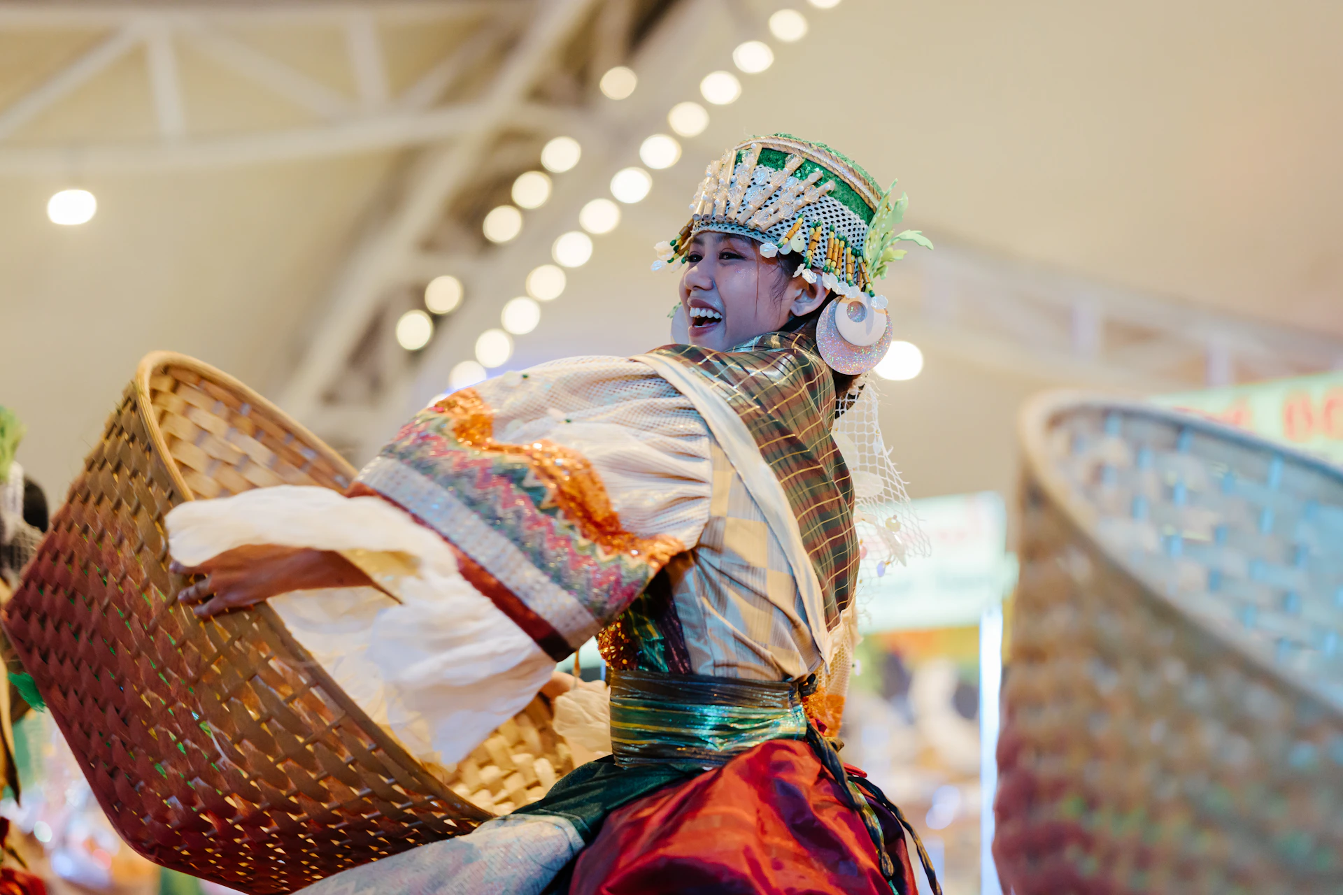 A person dances in traditional costume with a basket