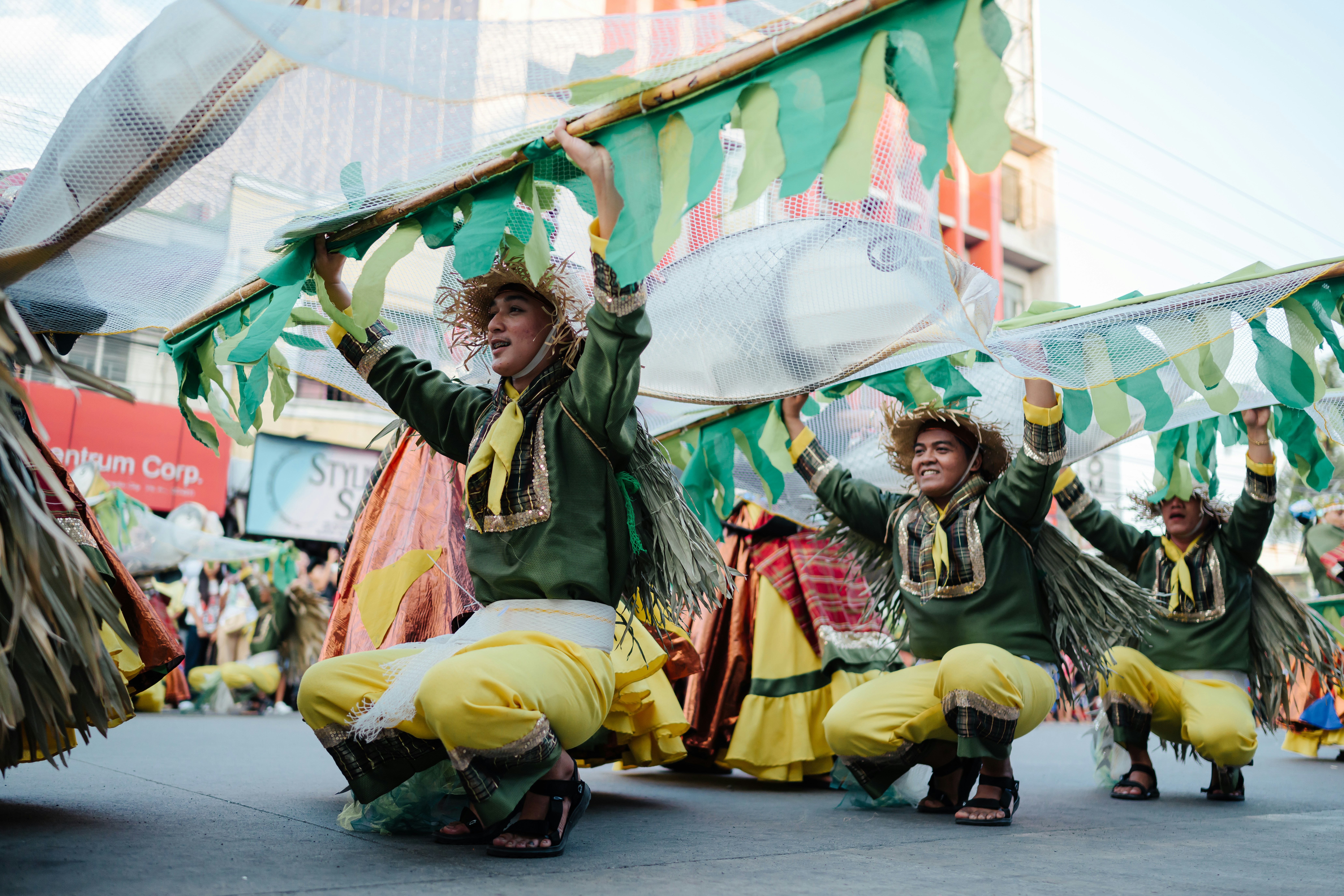People are performing a traditional dance during a festival.