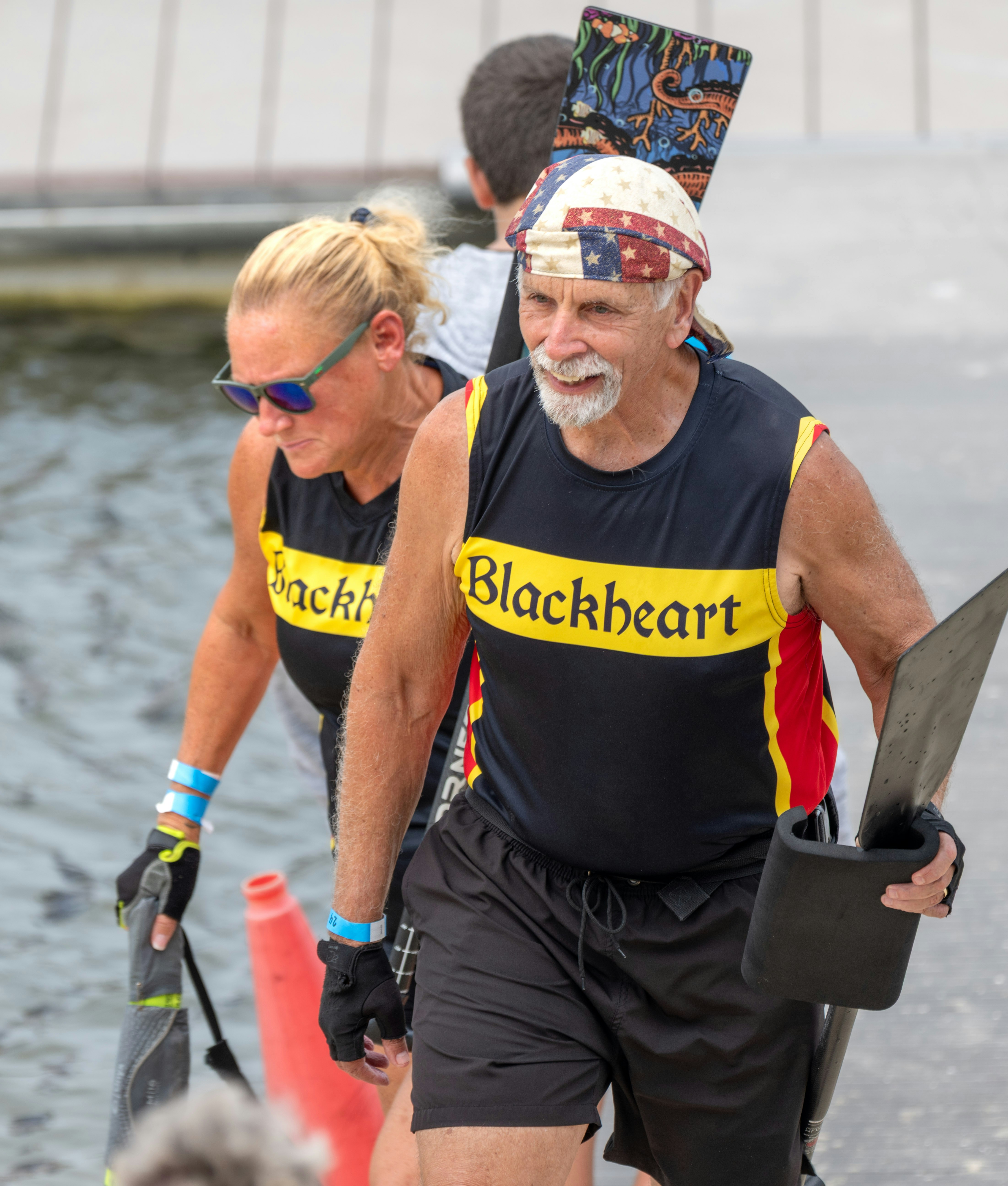 Dragon boat team members leaving the water.