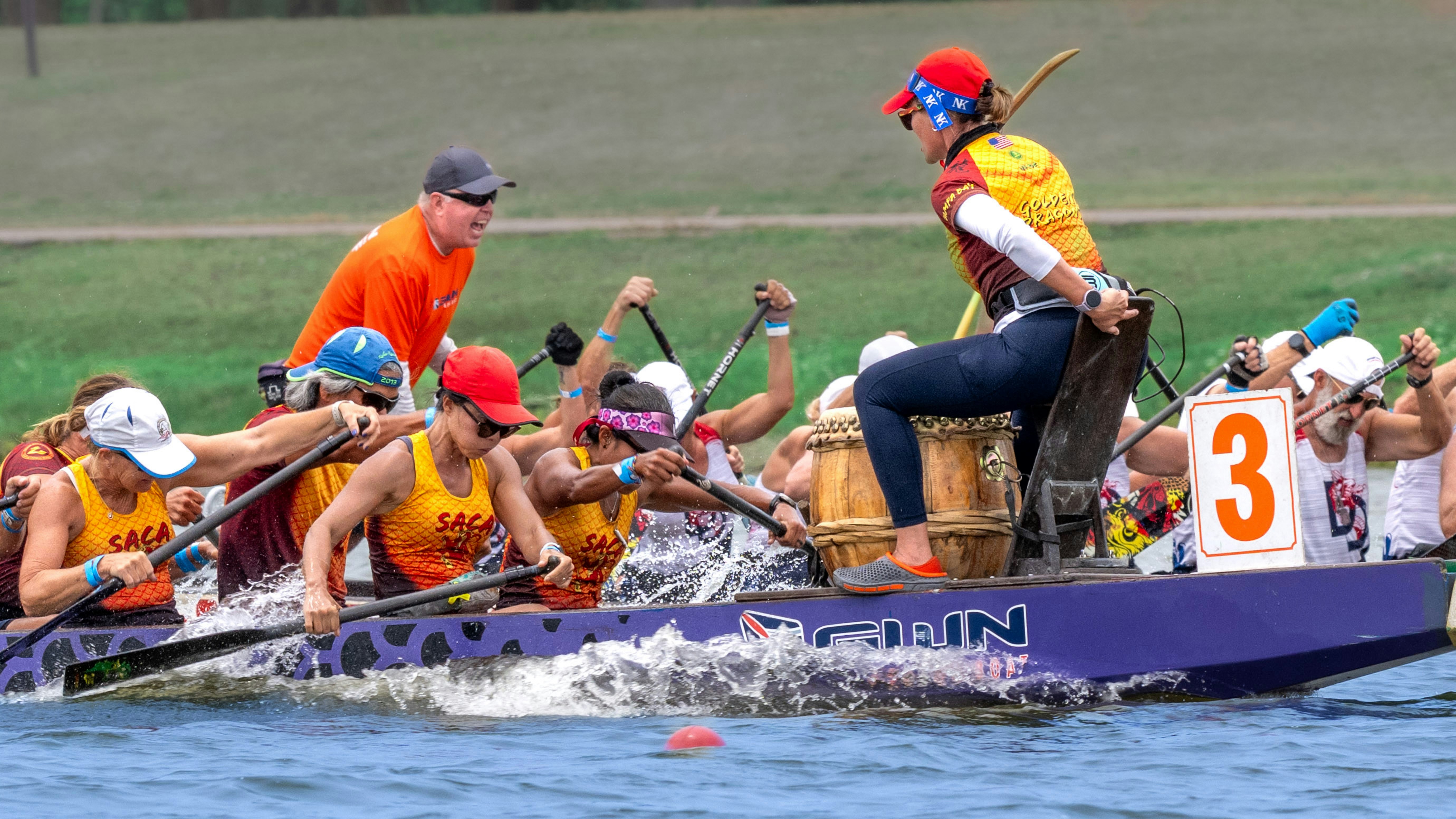 Dragon boat team races across the water.