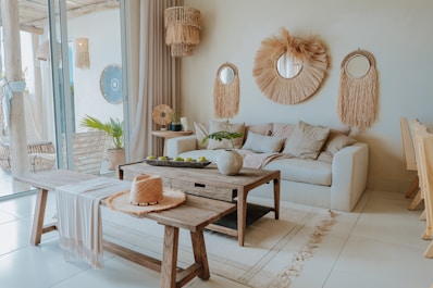 A stylish, neutral-toned living room is shown.