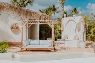 A relaxing outdoor lounge with a pool.