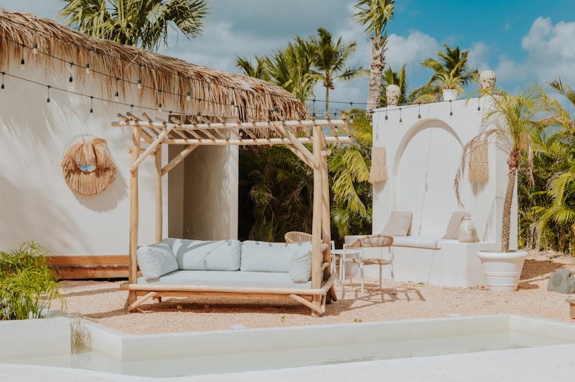 A relaxing outdoor lounge with a pool.