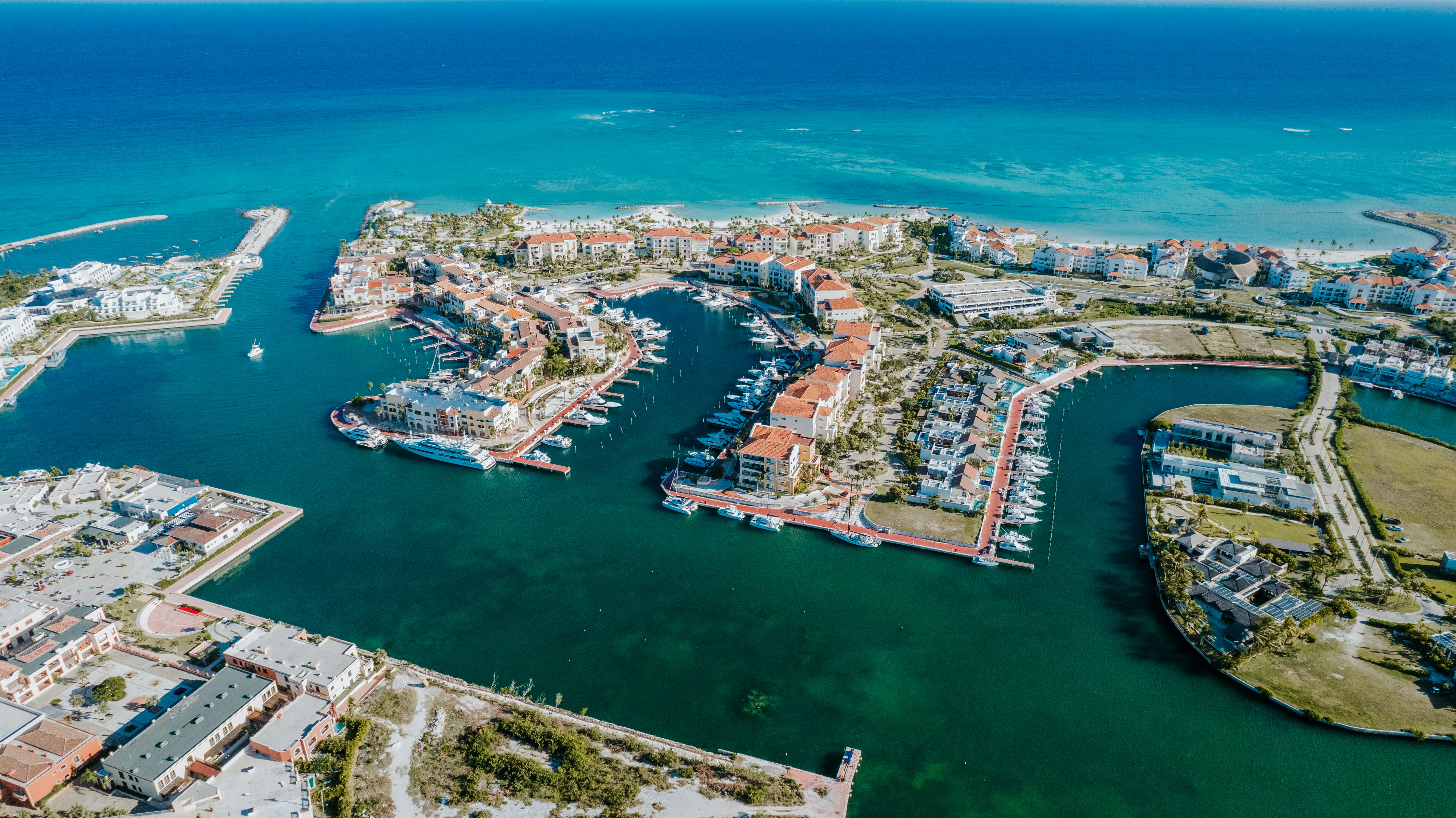 Aerial view shows a beautiful coastal marina.