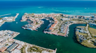 Aerial view shows a beautiful coastal marina.