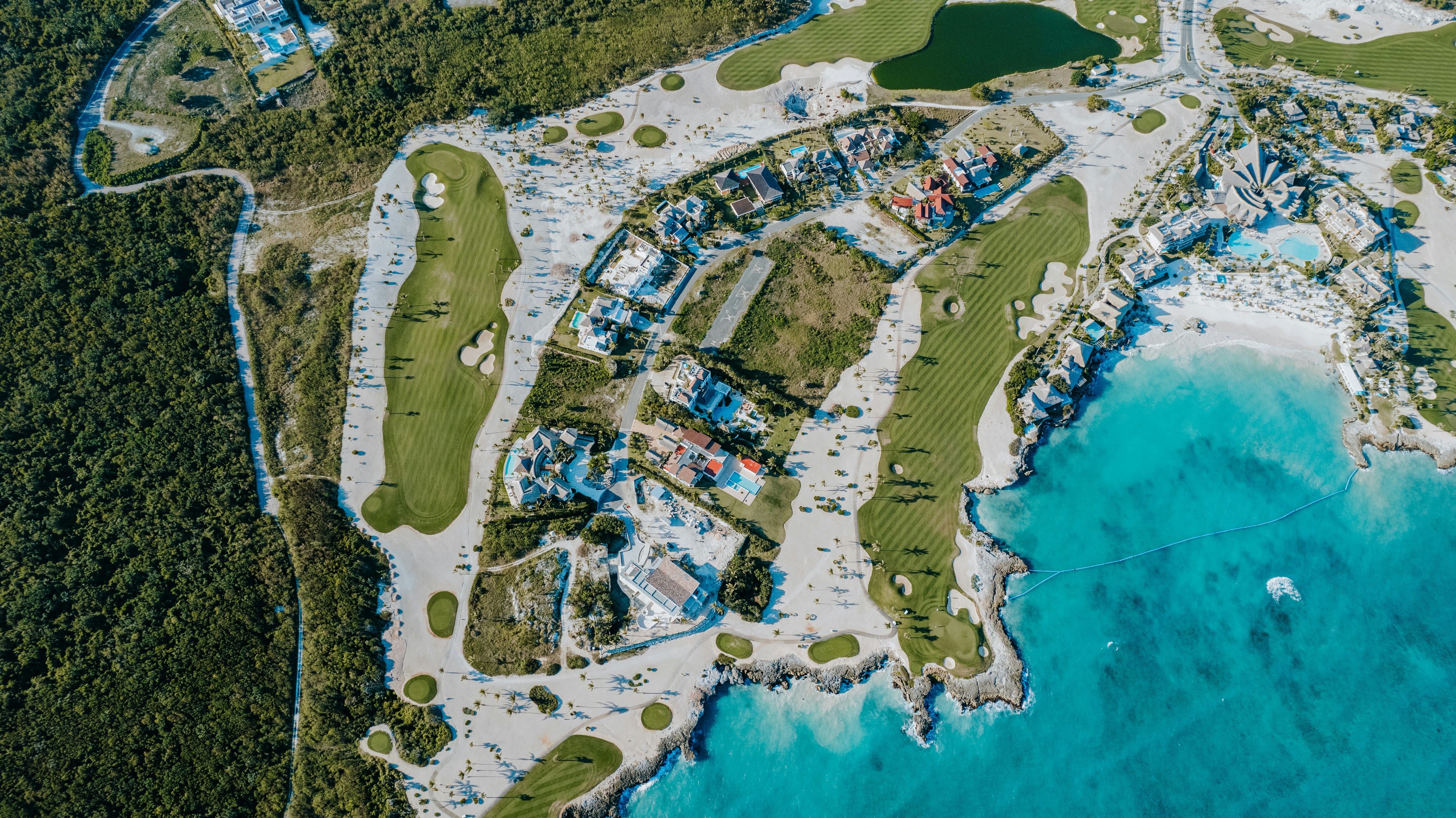 Aerial view of a golf course and beach resort