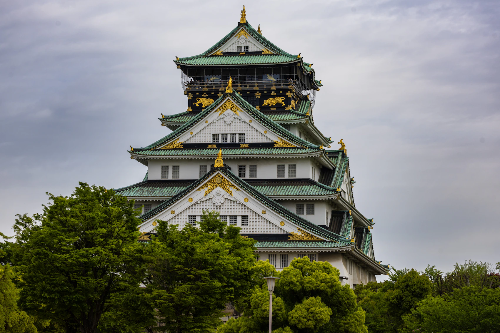 Historic Osaka Castle surrounded by greenery, Japan
