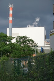 Factory building with a tall chimney.
