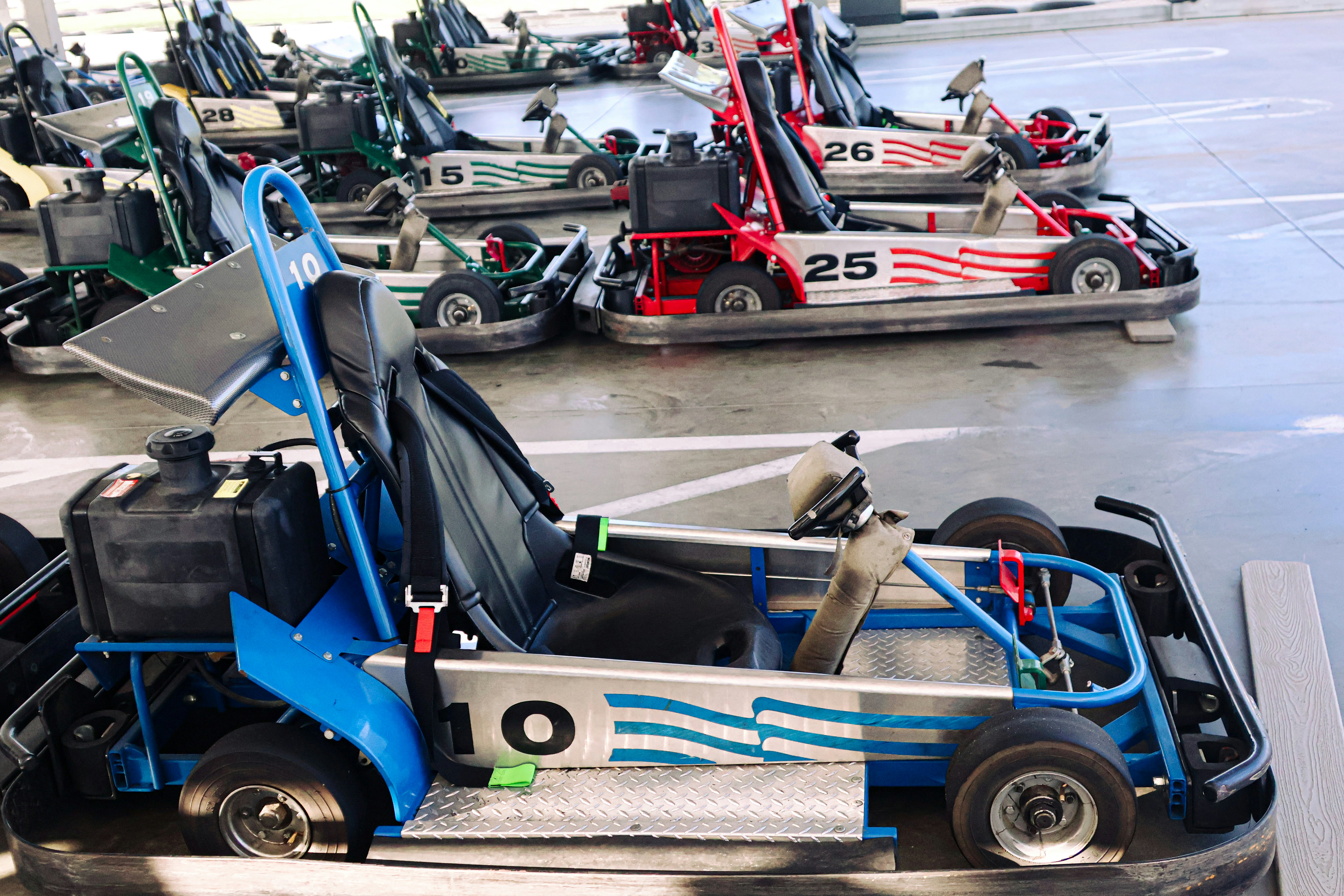 Go-karts are parked at a track.