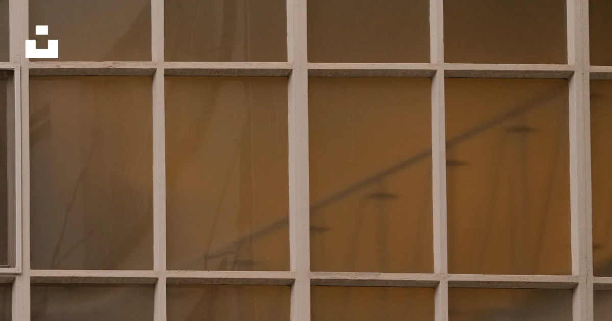 A grid of windows reflects a blurred interior. photo – Free Windows ...
