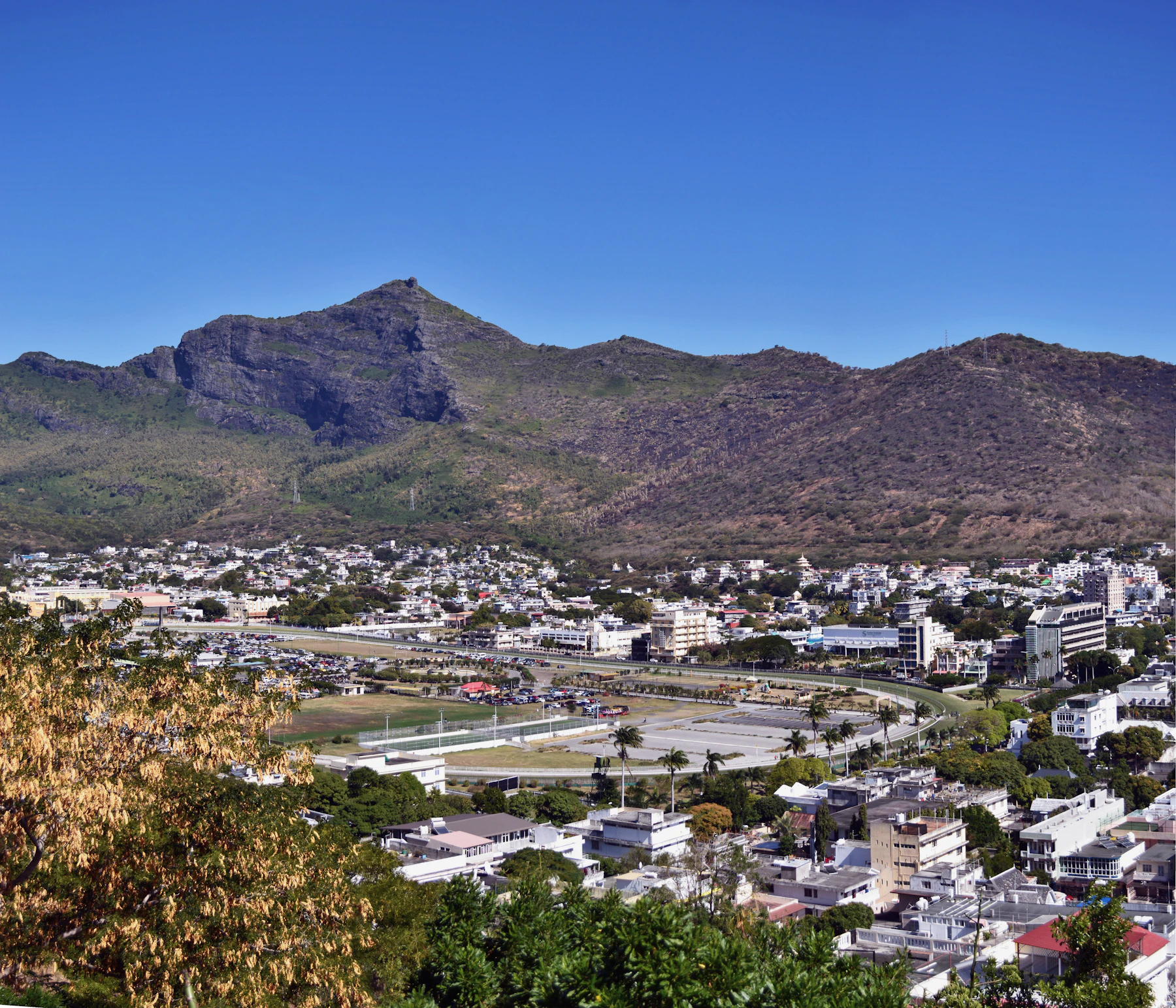 Port Louis and the Champ de Mars gathered below the mountains of Mauritius