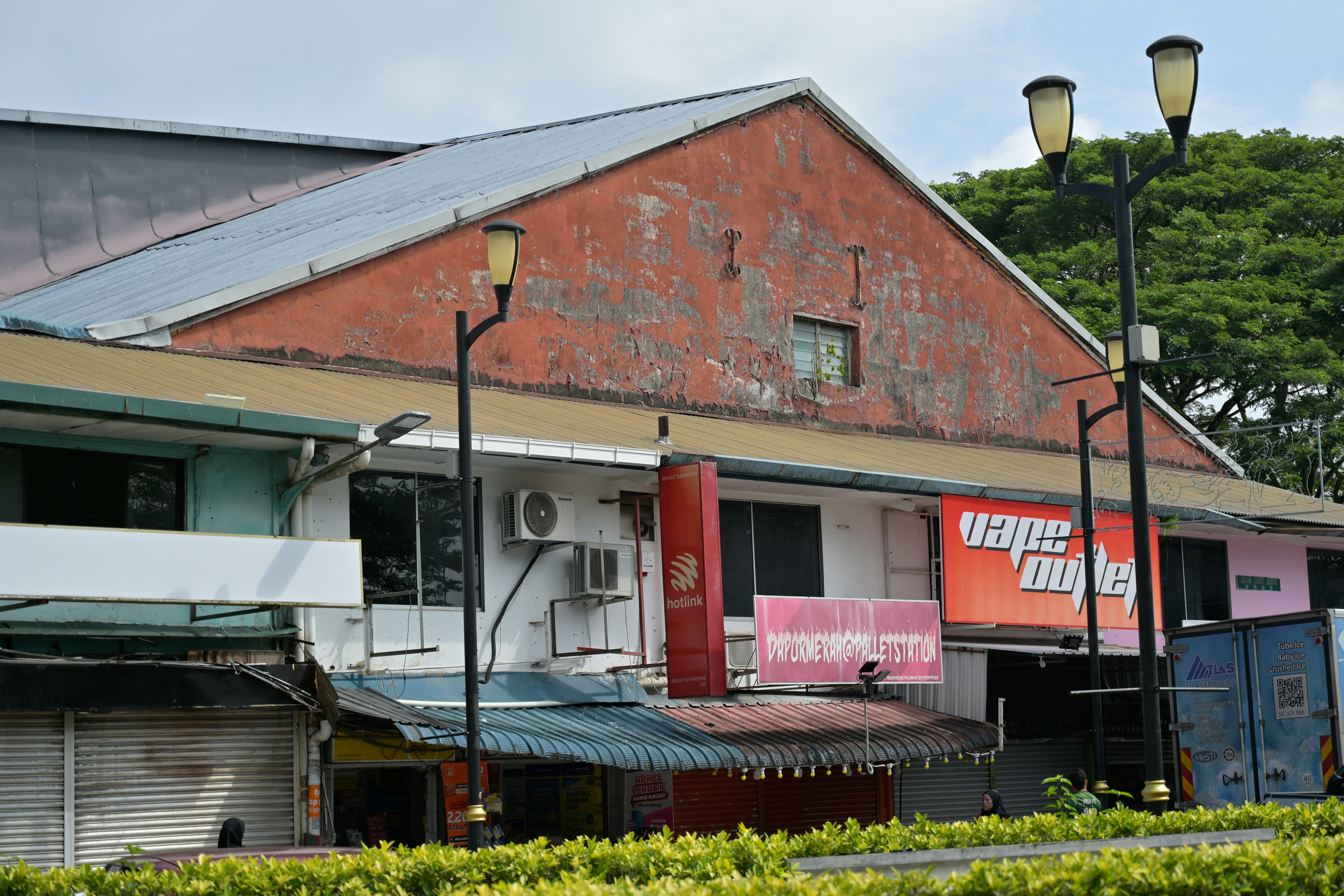 A row of old buildings with signs.