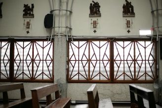 Church interior with windows and ornate decorations.