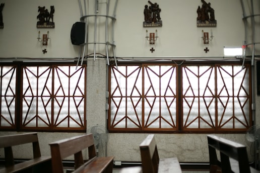 Church interior with windows and ornate decorations.