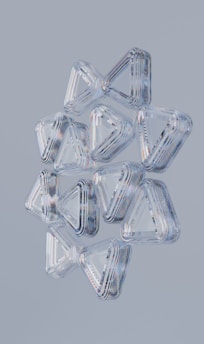 Transparent, layered, and geometric triangles are layered together.