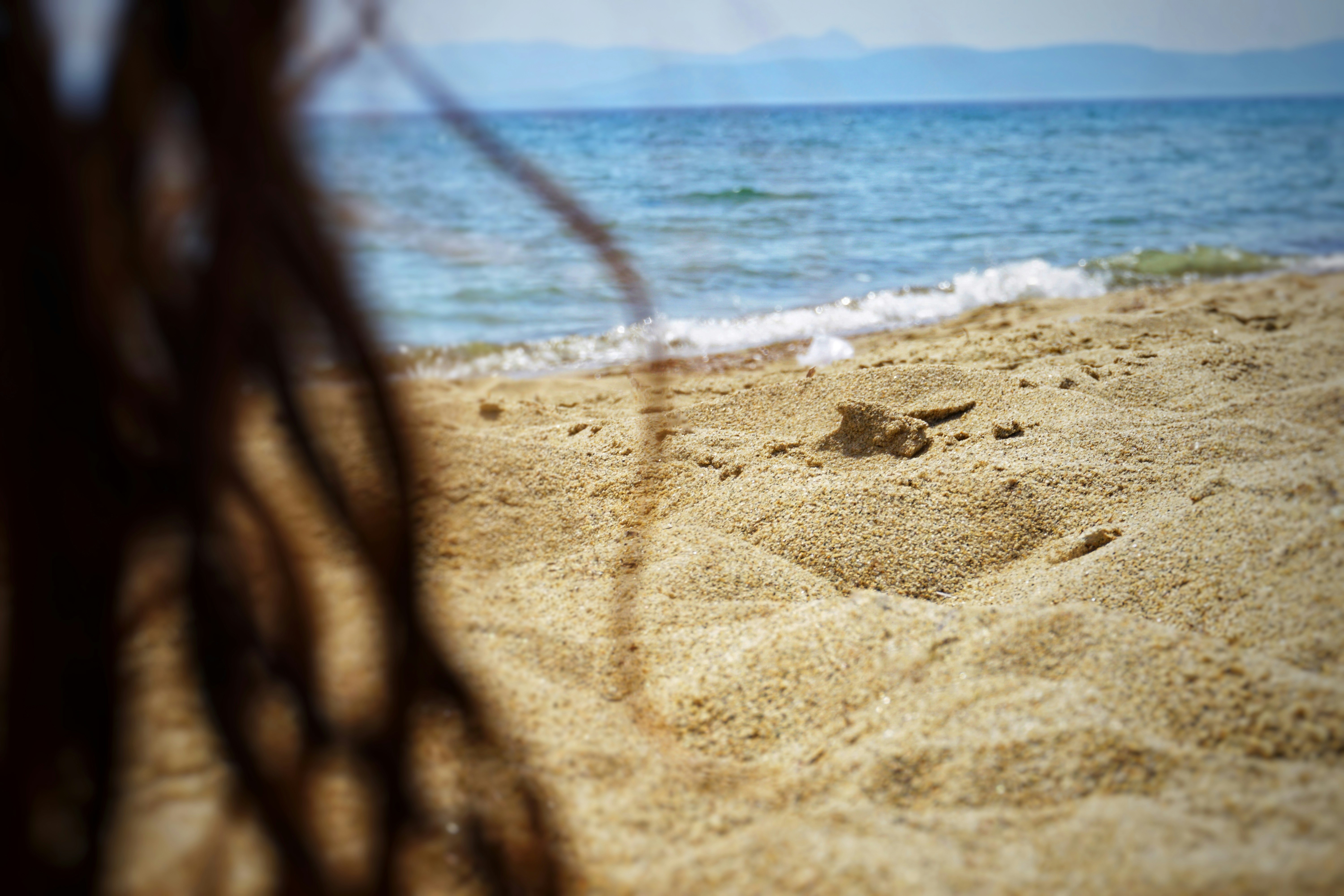Beach and ocean scene with sand and waves