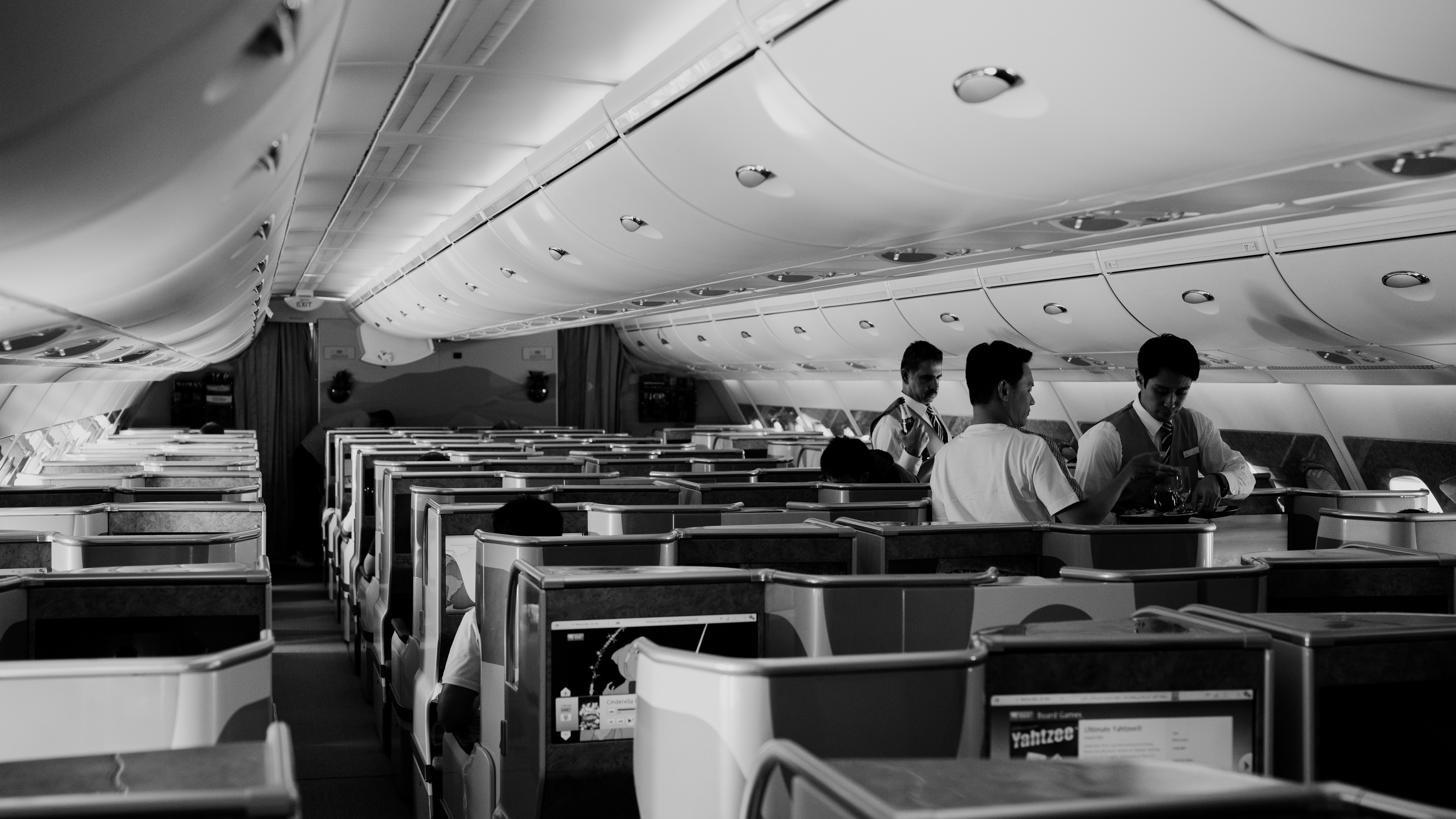 Inside an airplane, showing empty seats.