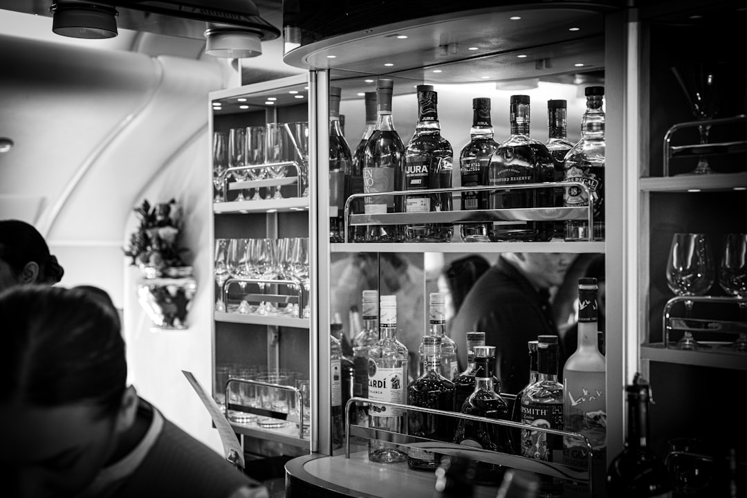 A well-stocked bar on an airplane.,