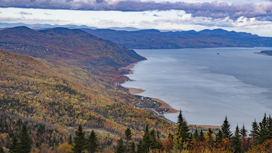 Mountains and a lake showcase autumn colors.