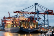 A large cargo ship at a busy port.