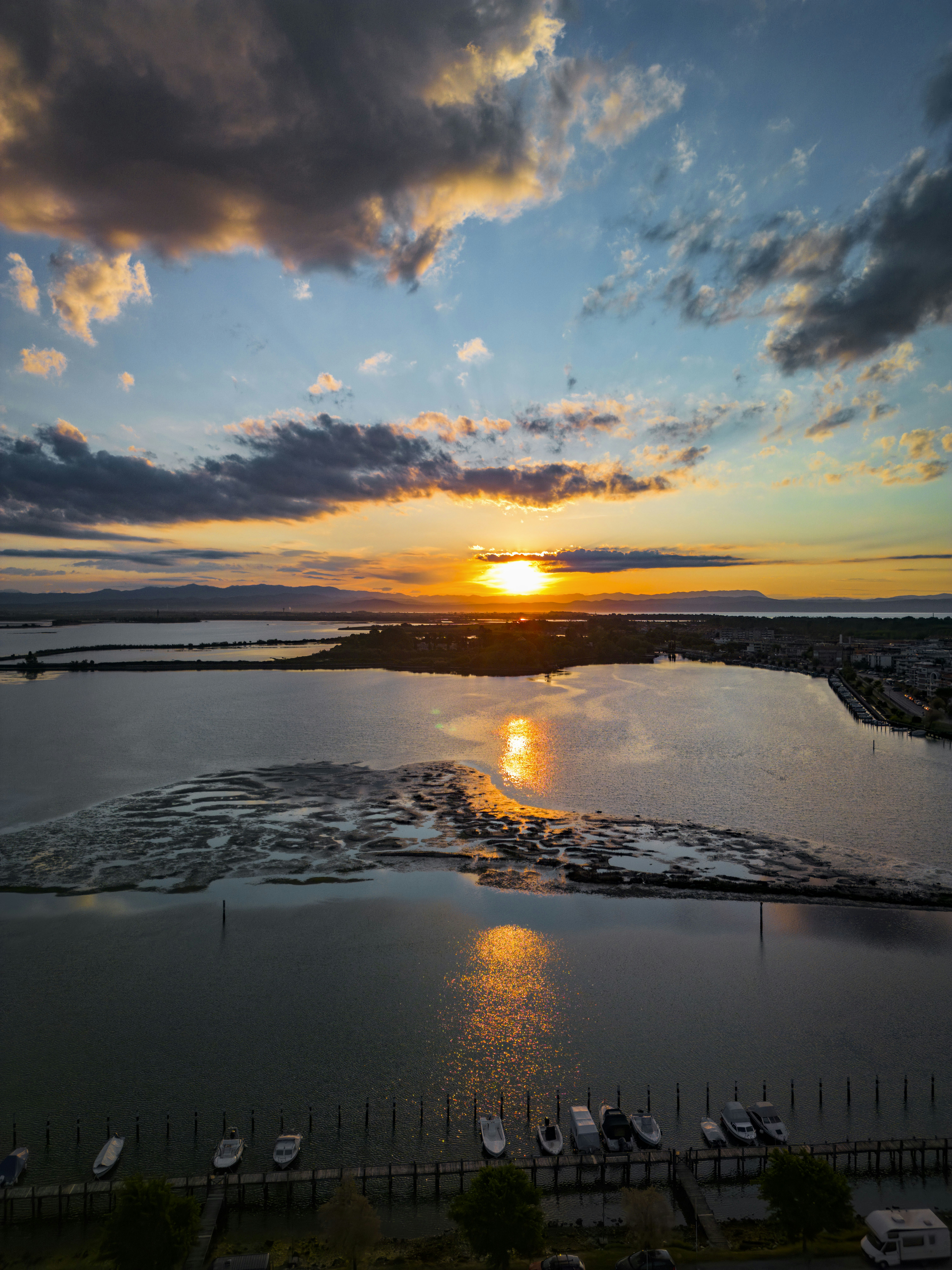 Sunset over the water with beautiful clouds.
