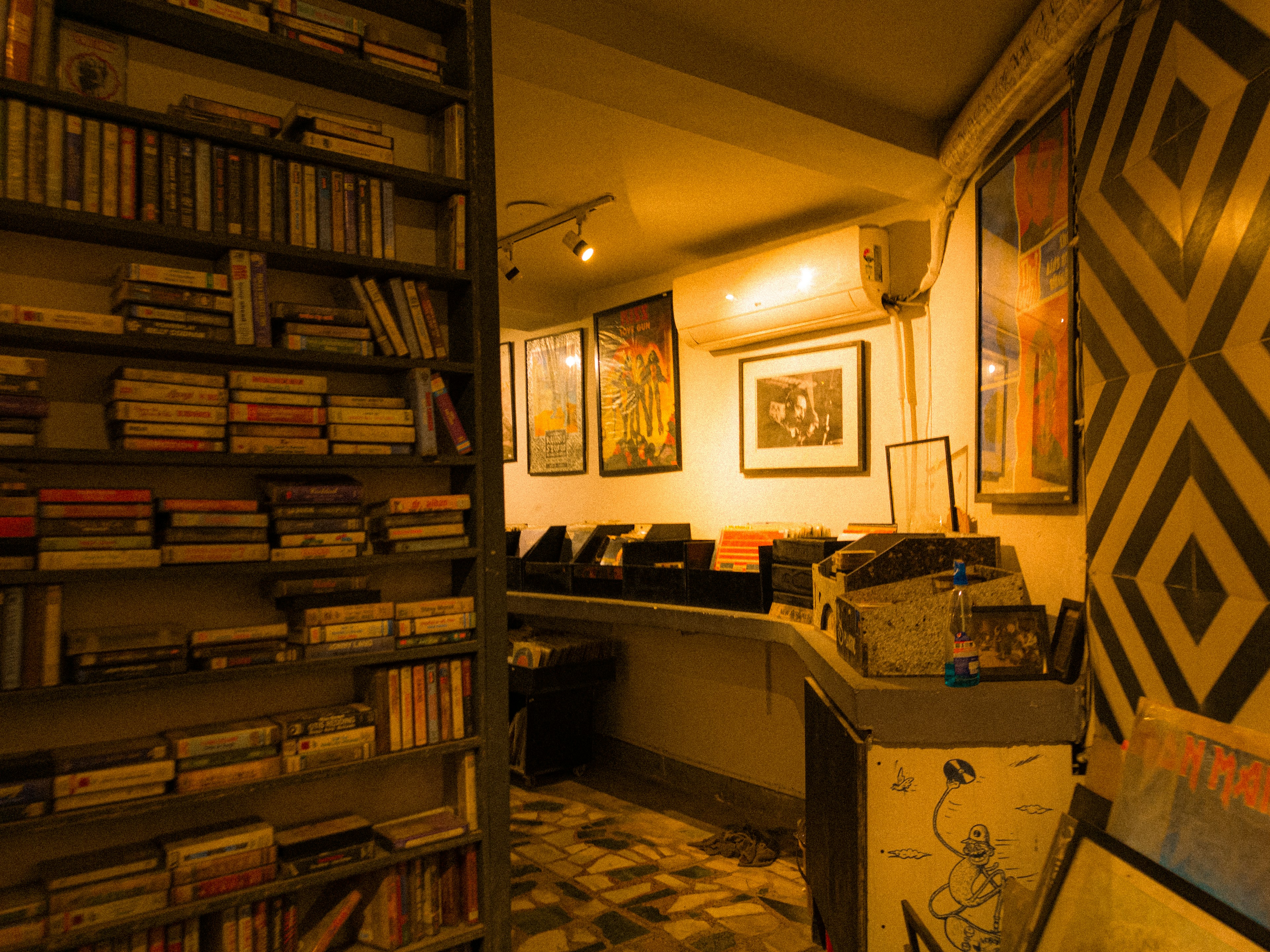 A cozy bookstore with books and artwork.