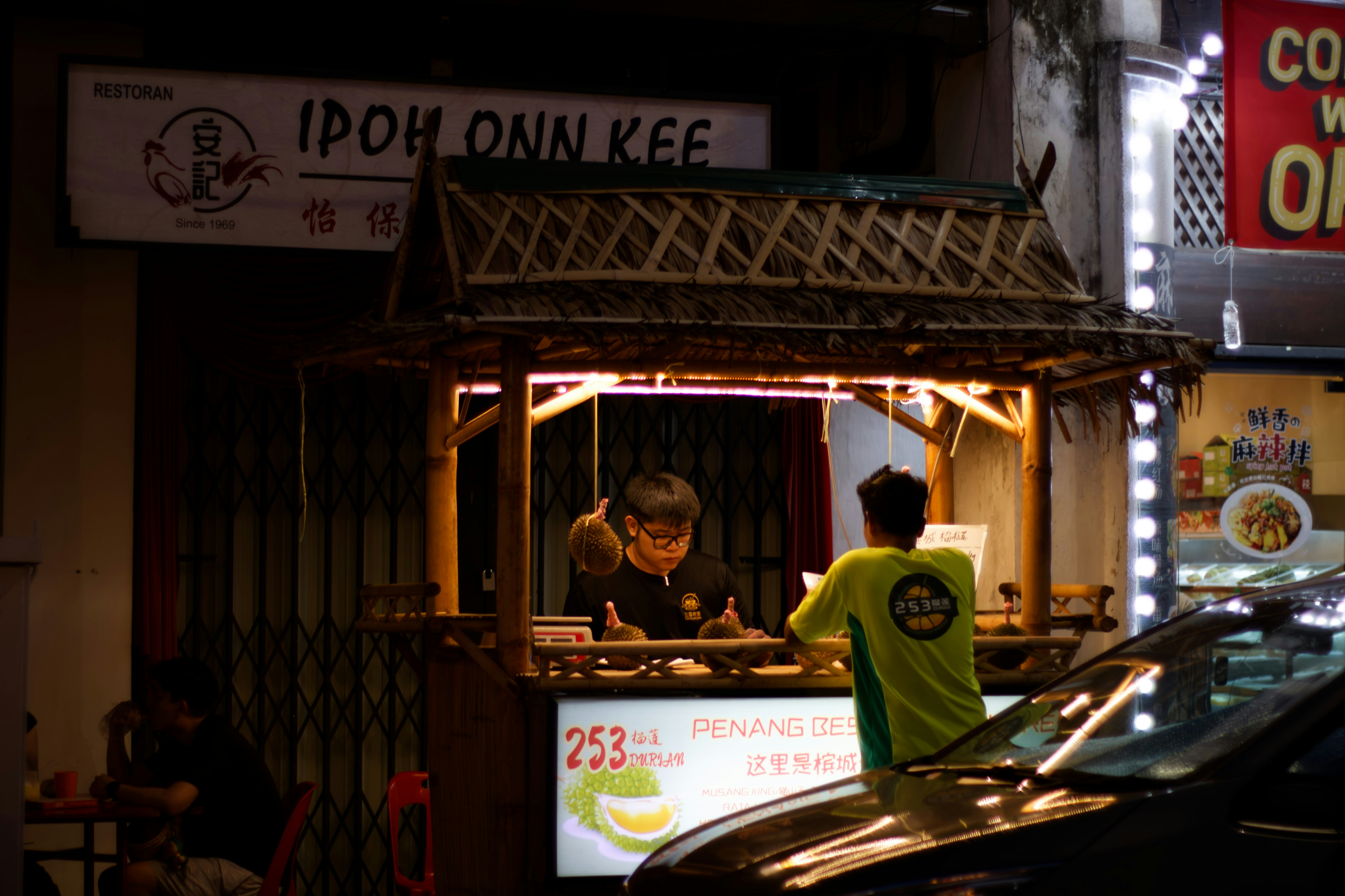 A food stall is open at night.